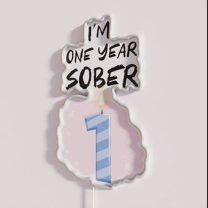 Recovery milestone celebrated with vibrant one year sobriety neon sign