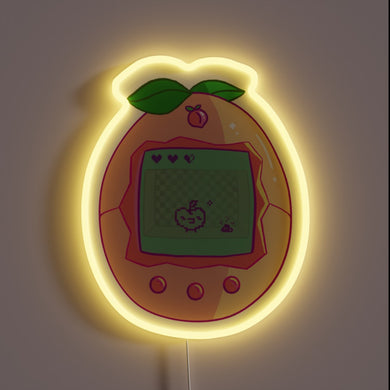 Retro meets cute with this peachy **Tamagotchi neon sign** – a glowing throwback for lovers of pixel pets and nostalgic vibes.