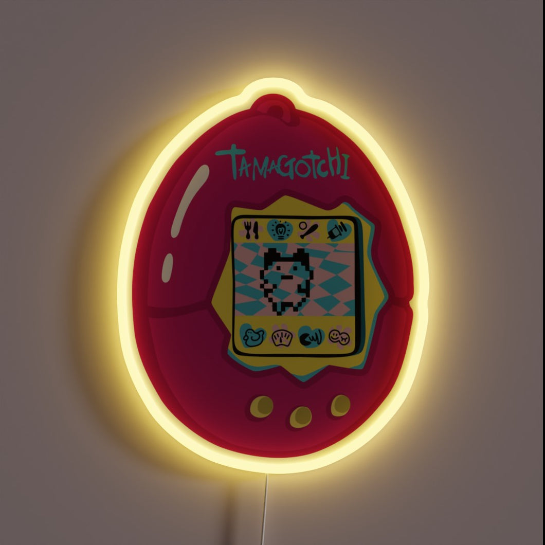 This glowing pink Tamagotchi neon sign brings nostalgic 90s vibes back to life—pixel pet and all!