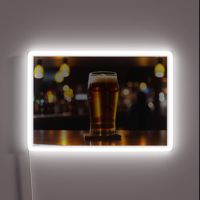 Glowing Neon Sign Featuring Iconic Beer Tap in Bar Setting