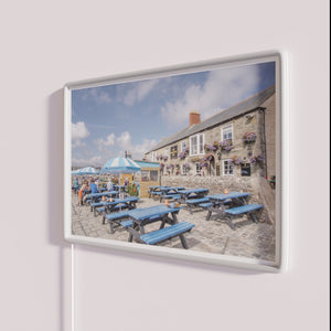 RGB illuminated Porthleven Harbour Inn pub bar sign exterior lighting