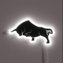 Charger l&#39;image dans la galerie, Neon sign of a charging black bull silhouette outlined in white.
