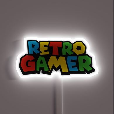 Colorful “Retro Gamer” neon sign in bold N64-style font.