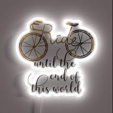 Charger l&#39;image dans la galerie, Neon light installation featuring &#39;Ride It Till The End&#39; phrase.