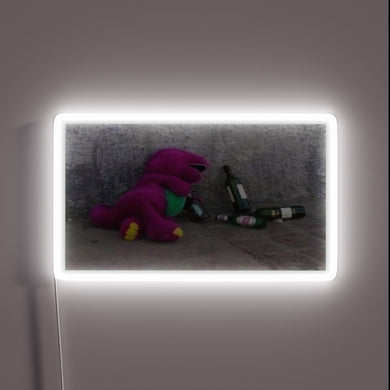 Iconic blue character Barney in bold RGB neon light display