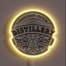 Charger l&#39;image dans la galerie, Vibrant RGB glow illuminates Sanderson Sisters Distillery logo with eerie charm.