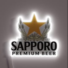 Charger l&#39;image dans la galerie, Vibrant Sapporo Brewery Logo Displayed in Colorful Neon Lights