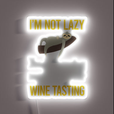 Vibrant RGB LED sign illuminates wine tasting with energy efficiency message.