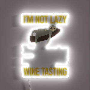 Vibrant RGB LED sign illuminates wine tasting with energy efficiency message.