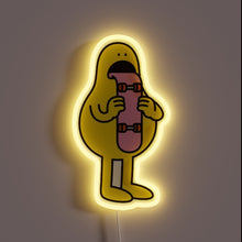 Charger l&#39;image dans la galerie, Skater vibes with a twist of weird — this neon character is straight-up licking a skateboard. Bold, goofy, and totally unique. For the wall that dares to be different. 🛹👅✨