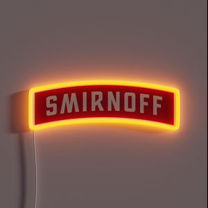 Neon sign shaped like a red Smirnoff vodka label with bold white text and glowing orange outline.
