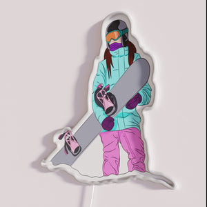 Colorful neon wall decor featuring a snowboarder girl silhouette design