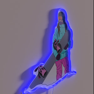 Fun-loving snowboarding female silhouette set against vibrant mountain night sky.