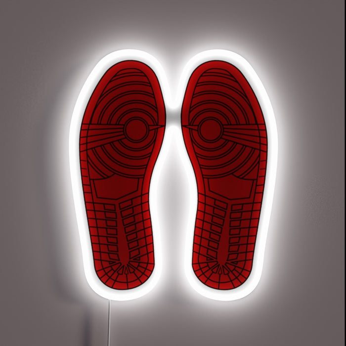 Those iconic outsoles are unmistakable—Air Jordan 1 vibes all day. The white neon outline gives it that gallery sneakerhead energy. 🔥👟🖼️