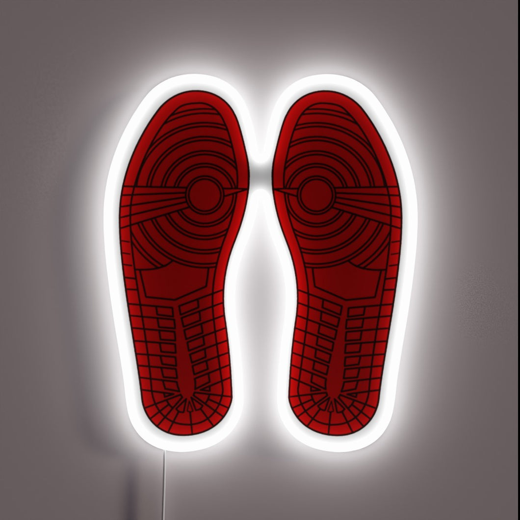 Those iconic outsoles are unmistakable—Air Jordan 1 vibes all day. The white neon outline gives it that gallery sneakerhead energy. 🔥👟🖼️