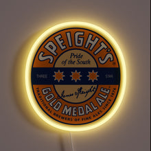 Charger l&#39;image dans la galerie, Round neon sign of Speight’s Gold Medal Ale logo with yellow glow.
