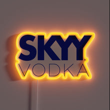 Charger l&#39;image dans la galerie, SKYY Vodka neon sign with orange glow.