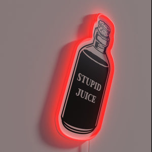 Glowing 'Stupid' neon sign with colorful RGB lighting effects.