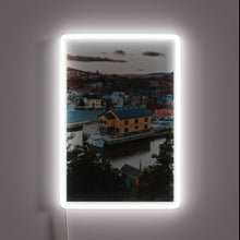 Charger l&#39;image dans la galerie, Vibrant sunset backdrop to iconic Quidi Vidi sign, Newfoundland&#39;s neon charm
