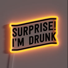 Charger l&#39;image dans la galerie, Luminous &#39;Surprise I&#39;m Drunk&#39; neon sign with vibrant RGB colors