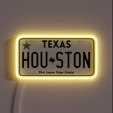 Charger l&#39;image dans la galerie, Houston Texas license plate neon sign with yellow glow.