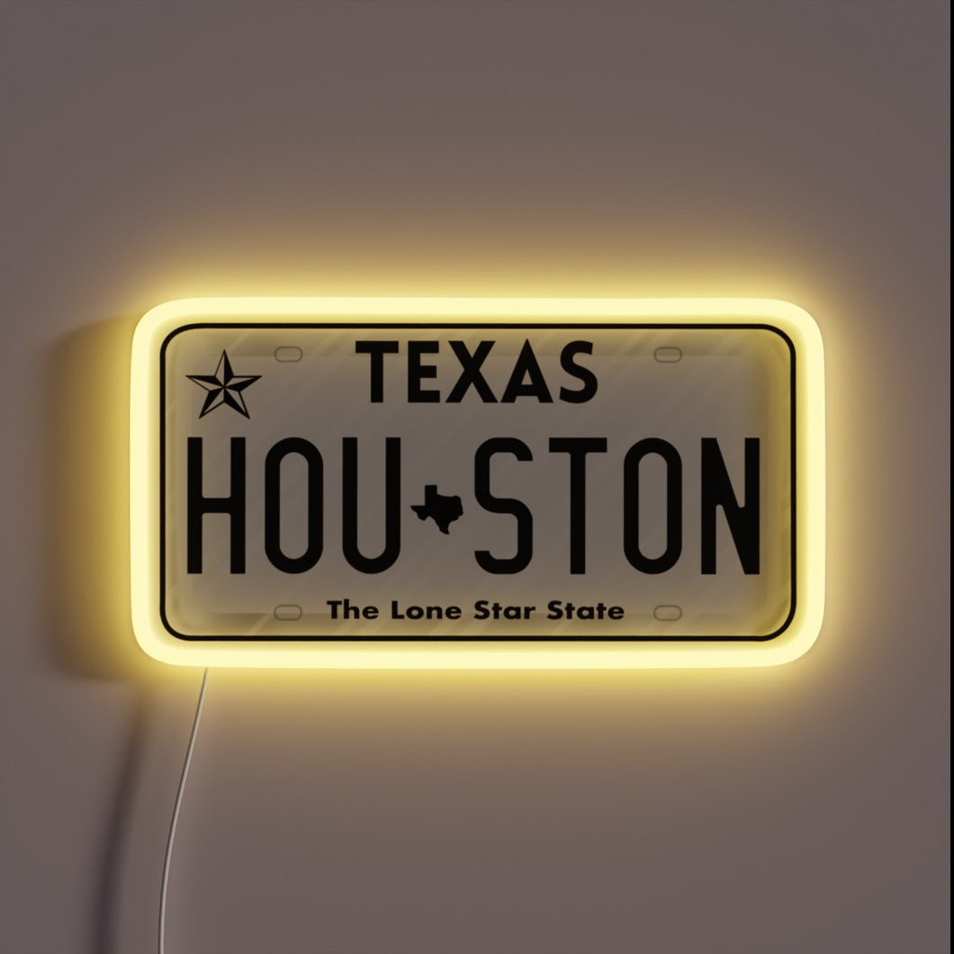 Houston Texas license plate neon sign with yellow glow.