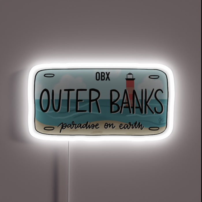 Outer Banks license plate design with beach and lighthouse, glowing white neon outline.
