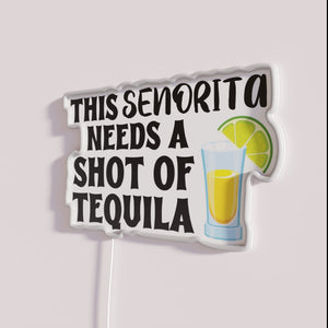 Vibrant RGB neon bar decor featuring sassy tequila cocktail quote