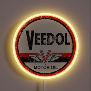 Vibrant RGB LED neon sign with colorful Veedol Oil design.