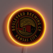 Charger l&#39;image dans la galerie, Alt text: Neon-lit round sign with &quot;Boulevard Brewing Co Kansas City&quot; logo in black, red, and gold, featuring a factory illustration.
