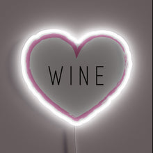 Charger l&#39;image dans la galerie, Romantic wine display with vibrant RGB neon heart shaped illumination.